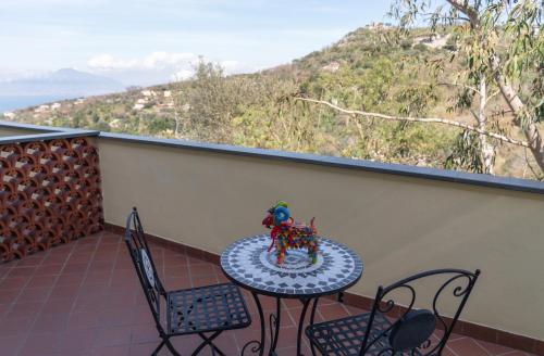 a toy horse on a table on a balcony at Agriturismo Primaluce in Sorrento