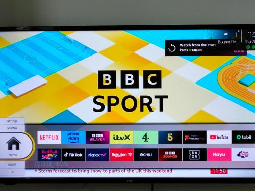 a television screen with the bbc sport logo on it at Guest suite 50m from the beach in Bognor Regis