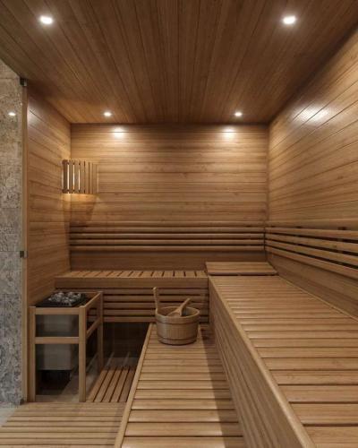 a sauna with wooden walls and a wooden ceiling at Atar Airport Hotel - Spa & Wellness in Arnavutköy