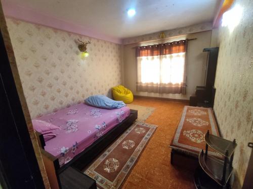 a bedroom with a purple bed and a window at Puru Boutique Home "PBH", Private Room, Apartment, Thamel, Swoyambhu, Benchen Monastery, Kathmandu, Nepal in Kathmandu