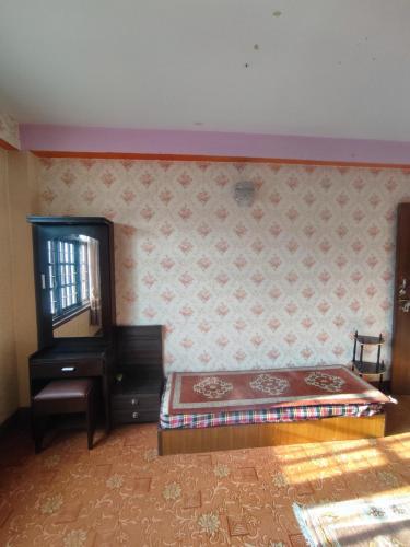 a bedroom with a bed and a dresser and a mirror at Puru Boutique Home "PBH", Private Room, Apartment, Thamel, Swoyambhu, Benchen Monastery, Kathmandu, Nepal in Kathmandu