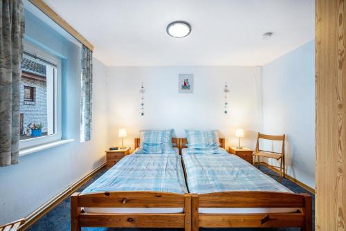 Ένα ή περισσότερα κρεβάτια σε δωμάτιο στο Ferienhaus Peters