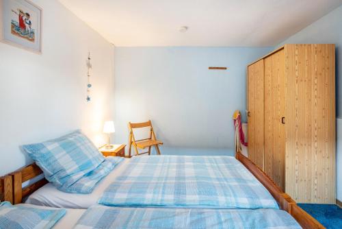 Ένα ή περισσότερα κρεβάτια σε δωμάτιο στο Ferienhaus Peters