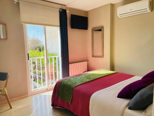 Postel nebo postele na pokoji v ubytování San Miguel B&B Granada