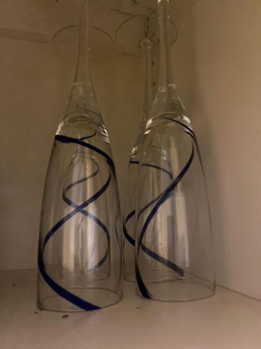 two clear glass vases sitting on a table at Central cozy accommodation, single room or bed in dormroom in Gothenburg