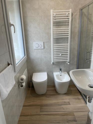 a bathroom with a toilet and a sink at ARBI VENICE STATiON in Mestre