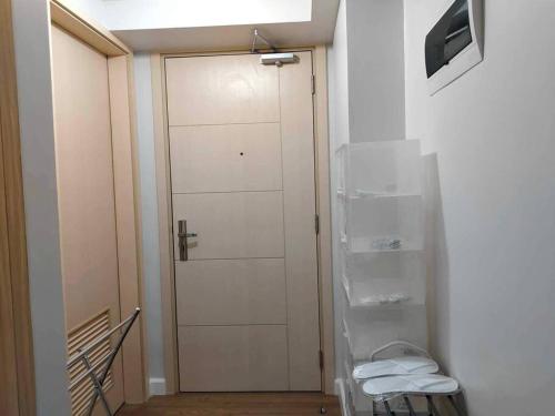 a hallway with a door and a television in a room at Solinea T3 805-A Elegant studio in Cebu City