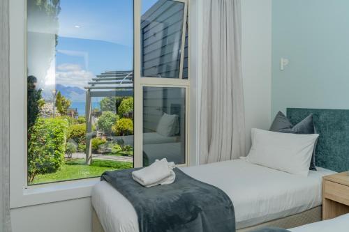 Кровать или кровати в номере Melbourne Lodge Queenstown