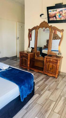 Ένα ή περισσότερα κρεβάτια σε δωμάτιο στο HostHub Guest House