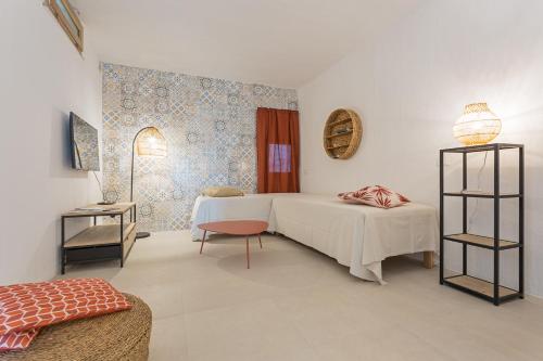 Ένα ή περισσότερα κρεβάτια σε δωμάτιο στο C'est la vue