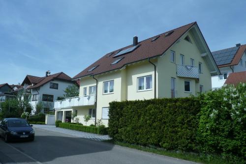 a house with a car parked in front of it at Blackforest Apartment in Freudenstadt
