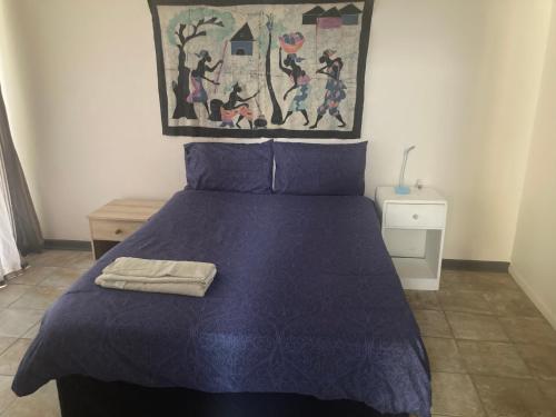 Ένα ή περισσότερα κρεβάτια σε δωμάτιο στο Gardenroute Accomodation 750 mtr. the beach