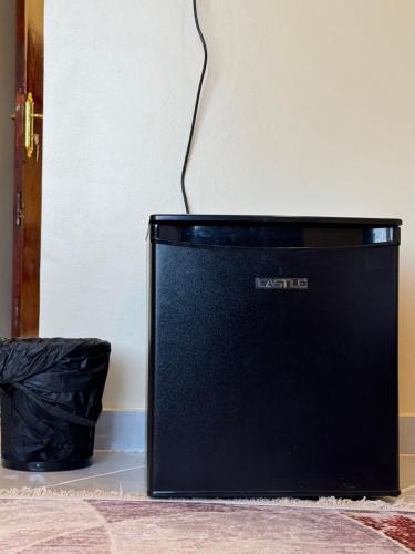 a black laptop computer sitting on top of a counter at DoroKa Nubian House in Aswan