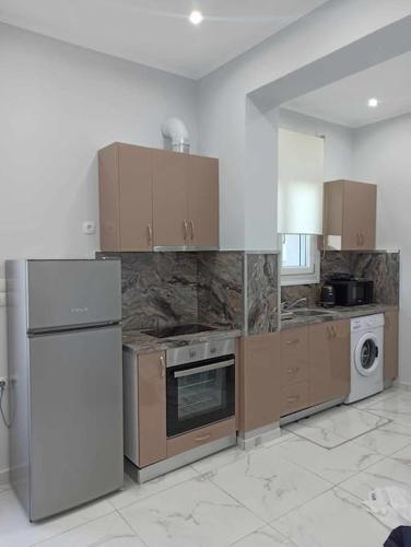 Kuchyň nebo kuchyňský kout v ubytování Chios Cozy Apartment 3