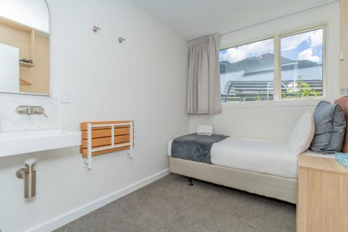 Кровать или кровати в номере Melbourne Lodge Queenstown