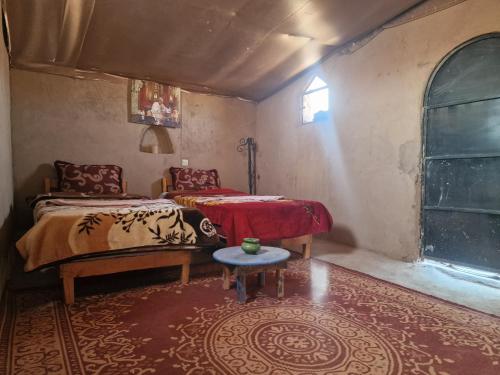 Postel nebo postele na pokoji v ubytování Camel House camp