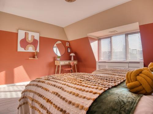 a bedroom with a large bed and a window at London Fulham - hot tub, parking, games & arcade in London