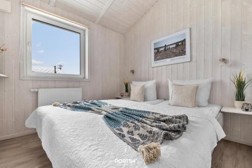 Ένα ή περισσότερα κρεβάτια σε δωμάτιο στο Ferienhaus Blocksberg - Sankt Andreasberg im Harz