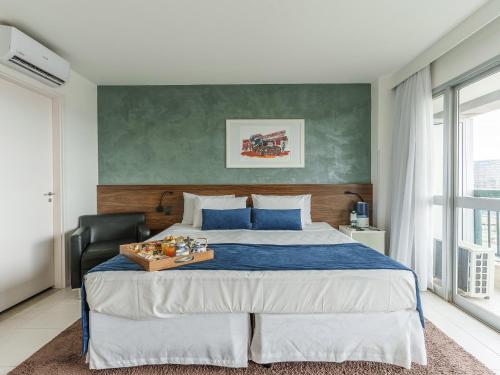 Cama ou camas em um quarto em Hplus Vision Executive