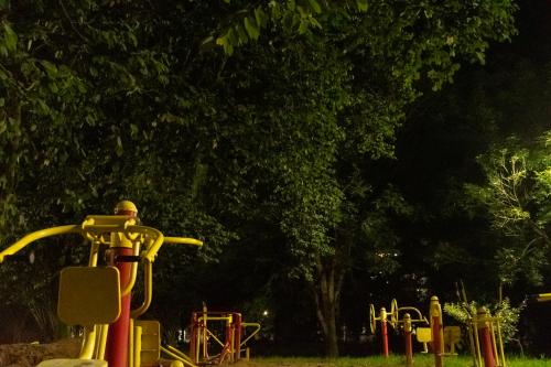 a group of playground equipment in a park at night at Home Sweet Home in Pitalito