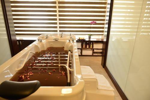 a chocolate cake in a bath tub in a room at EA Hotel Atlantic Palace in Karlovy Vary