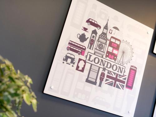 a book with a drawing of london on it at YHA London Thameside in London