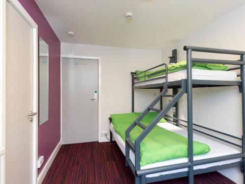 a bunk bed room with two bunk beds in it at YHA London Thameside in London