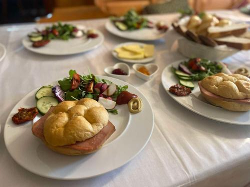 a table with several plates of food on it at Gasthof Frasswirt in Frass