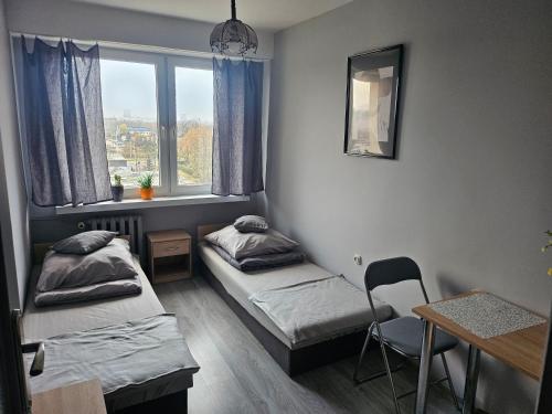 Ένα ή περισσότερα κρεβάτια σε δωμάτιο στο The First Atlas Arena Apartament