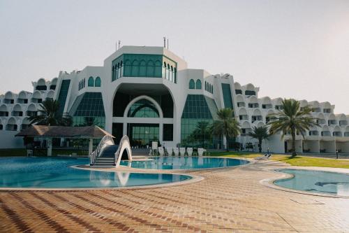 a view of the exterior of a resort at Mirfa Hotel in Al Marfaʼ