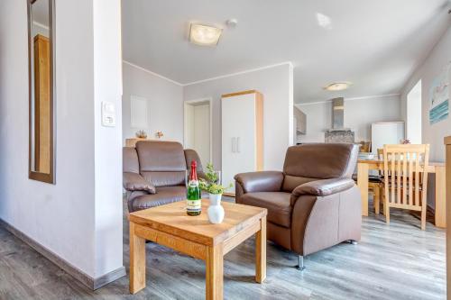 a living room with two chairs and a table at Peenemünde, Seglerhafen_ST_Jolle 16 in Peenemünde