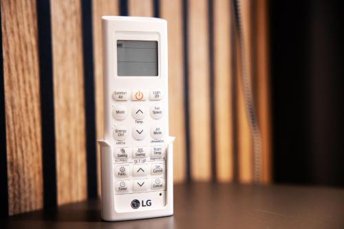 a remote control sitting on top of a table at OrestaLiving - BrigittineurLände in Vienna