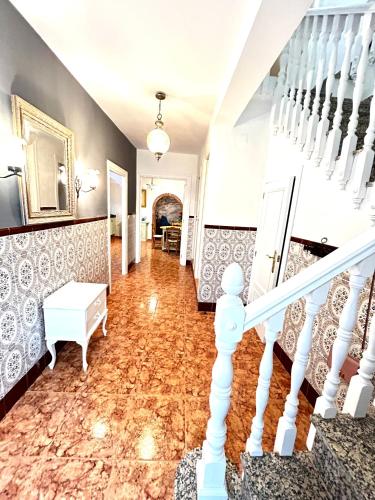 a hallway of a home with a staircase and a stair case at Casa Elena in Orcera