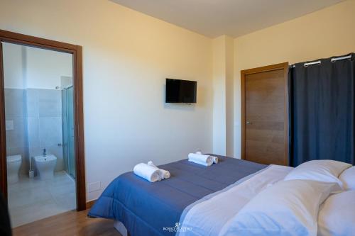 Ένα ή περισσότερα κρεβάτια σε δωμάτιο στο Agriturismo il Tratturo B&B