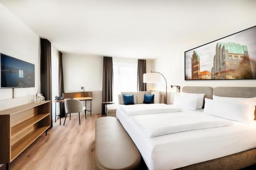 Postel nebo postele na pokoji v ubytování Welcome Hotel Darmstadt City Center