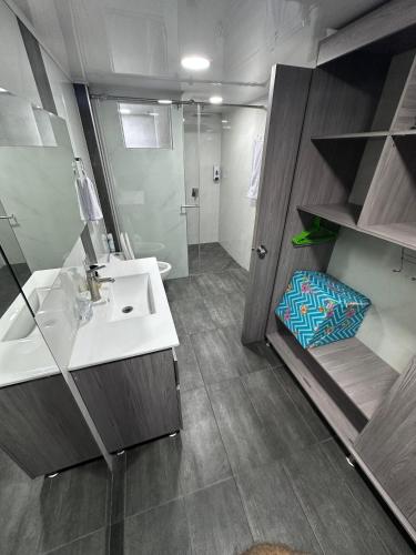 a bathroom with a sink and a shower at Mirador Alacala in Envigado