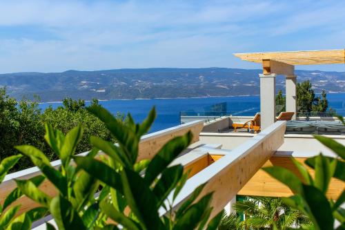 a house with a view of the ocean at Villa Majestic Vista - Private Pool in Lokva Rogoznica