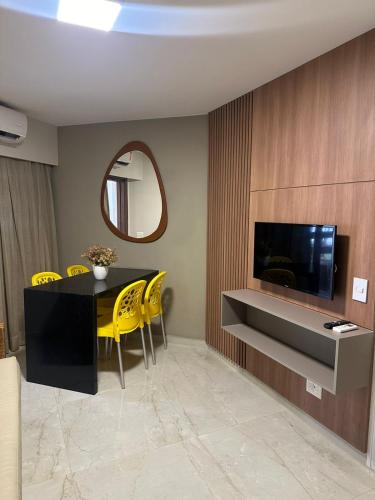 TV a/nebo společenská místnost v ubytování Jatiuca Suítes Resort FLAT