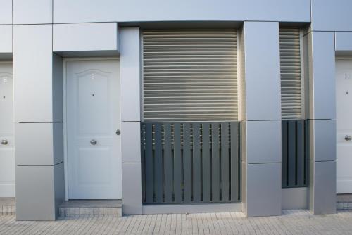 a pair of doors on a building at Apartamentos La Estación M&S in Albacete