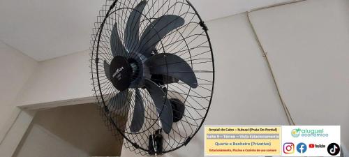 a fan hanging from the ceiling in a room at Arraial do Cabo – Subuai Village - Aluguel Econômico in Arraial do Cabo