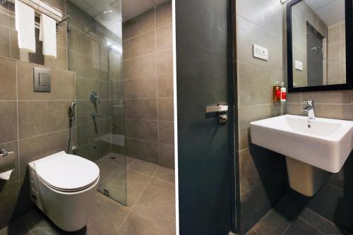 two pictures of a bathroom with a toilet and a sink at Super Townhouse RCC Elite in Hyderabad