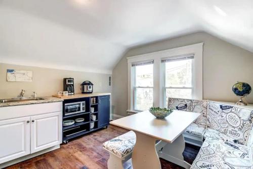 a kitchen and living room with a table and a couch at Cozy studio near Cleve Clinic Case in Cleveland Heights