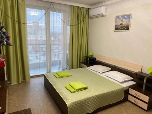 Ένα ή περισσότερα κρεβάτια σε δωμάτιο στο Green Studio Hotel Sol e Mar