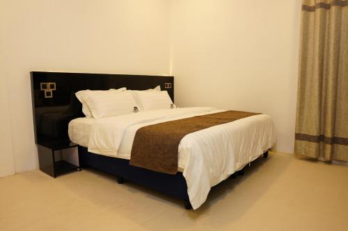 Postel nebo postele na pokoji v ubytování MOONSHELL RESIDENCE