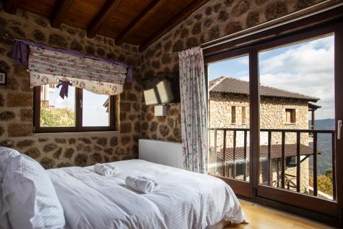 Ένα ή περισσότερα κρεβάτια σε δωμάτιο στο Ornytion Cozy House
