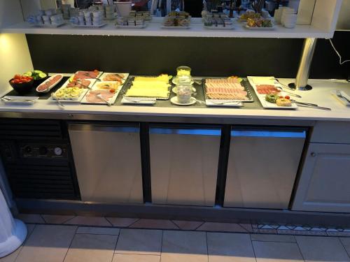 a buffet line with many different types of food at Villa Alba in Binz
