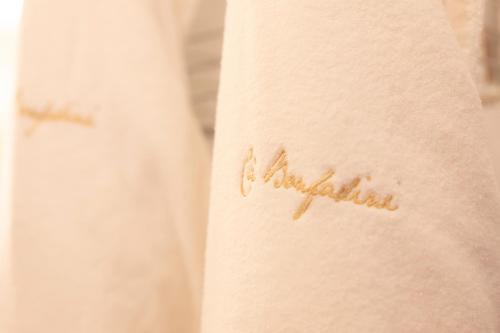 a tattoo of the word australia on the arm at Ca' Bonfadini Historic Experience in Venice
