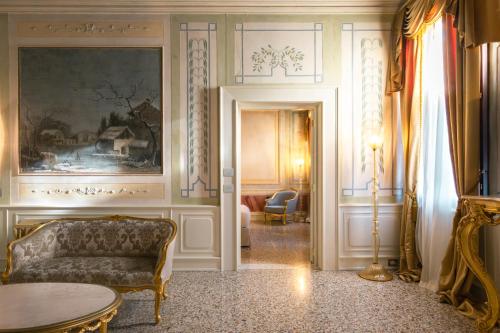 a living room with a couch and a table at Ca' Bonfadini Historic Experience in Venice