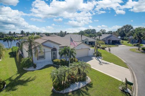 an aerial view of a house with a flag at Sunny Fort Myers Home with Heated Pool! in Fort Myers