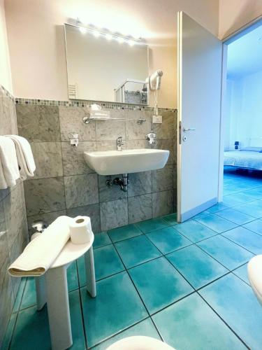 a bathroom with a sink and a mirror at Villa Marina in Venice-Lido